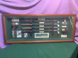 "Collectible vintage 'History of Golf, Evolution of Irons' shadow box featuring miniature golf clubs, historical golf balls, and memorabilia—perfect for golf enthusiasts and collectors.