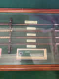 "Collectible vintage 'History of Golf, Evolution of Irons' shadow box featuring miniature golf clubs, historical golf balls, and memorabilia—perfect for golf enthusiasts and collectors.