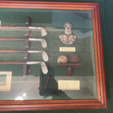 "Collectible vintage 'History of Golf, Evolution of Irons' shadow box featuring miniature golf clubs, historical golf balls, and memorabilia—perfect for golf enthusiasts and collectors.