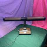 Vintage 1970s-1980s faux woodgrain fluorescent desk lamp with retro design, wood-look finish, and soft even lighting—perfect for workspaces and home offices.
