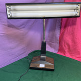 Vintage 1970s-1980s faux woodgrain fluorescent desk lamp with retro design, wood-look finish, and soft even lighting—perfect for workspaces and home offices.