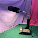 Vintage 1970s-1980s faux woodgrain fluorescent desk lamp with retro design, wood-look finish, and soft even lighting—perfect for workspaces and home offices.
