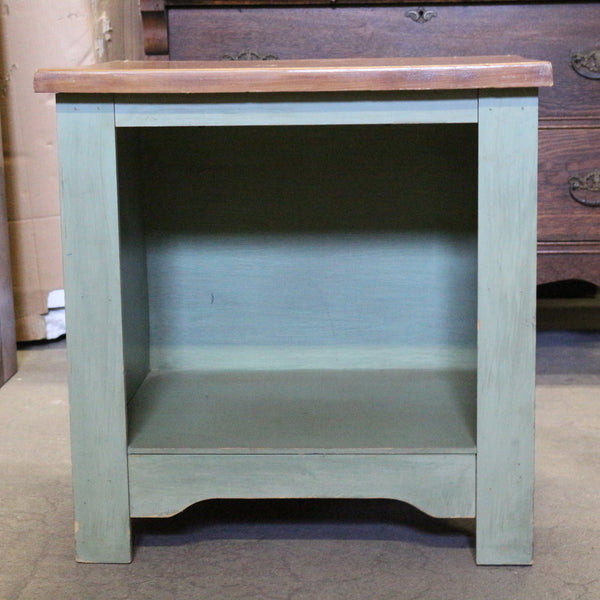 Sage green wooden nightstand with drawers and soft finish