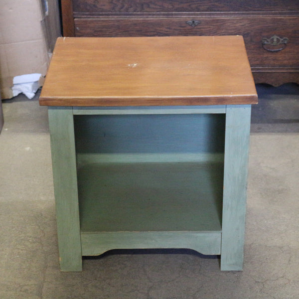 Sage green wooden nightstand with drawers and soft finish