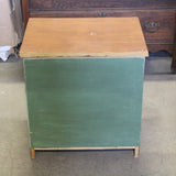 Sage green wooden nightstand with drawers and soft finish
