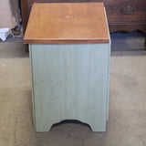 Sage green wooden nightstand with drawers and soft finish