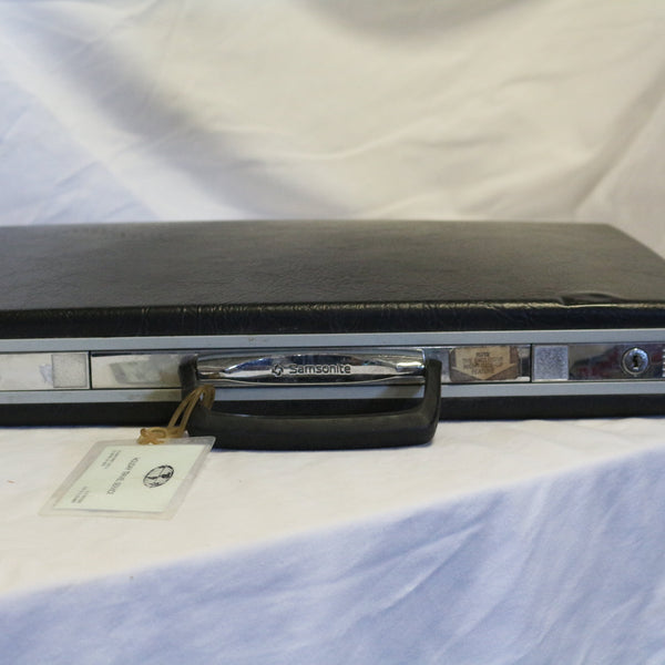 Vintage gray Samsonite hard shell briefcase with snap lock and key