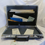 Vintage gray Samsonite hard shell briefcase with snap lock and key