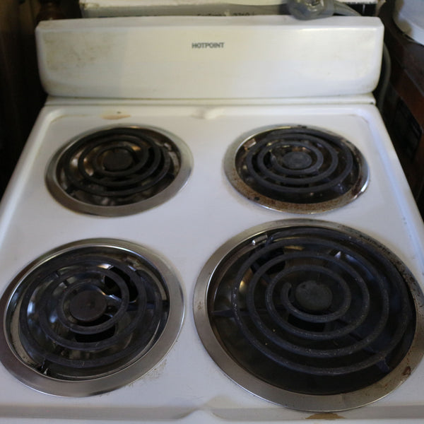 White 20-inch Hotpoint electric stove with 4 burners and oven