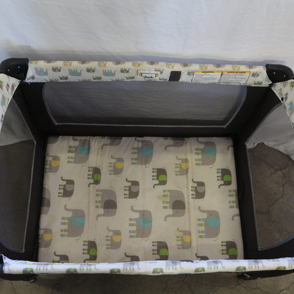 Baby Trend portable infant playard with elephant print mattress and mesh sides