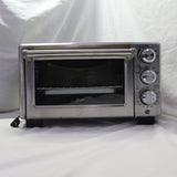 Used Oster stainless steel 4-slice toaster oven with dials and accessories