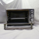 Used Oster stainless steel 4-slice toaster oven with dials and accessories