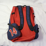 Used Águilas de Mexicali red and navy backpack with eagle logo and number 14 patch