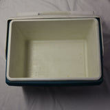 Vintage Igloo Playmate 14-quart personal cooler in blue and white with classic push-button swivel lid, shown from angled side view.