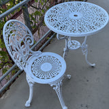 Vintage white cast iron bistro table set with intricate Victorian-style detailing—perfect for patios, gardens, or balconies for a charming, timeless look